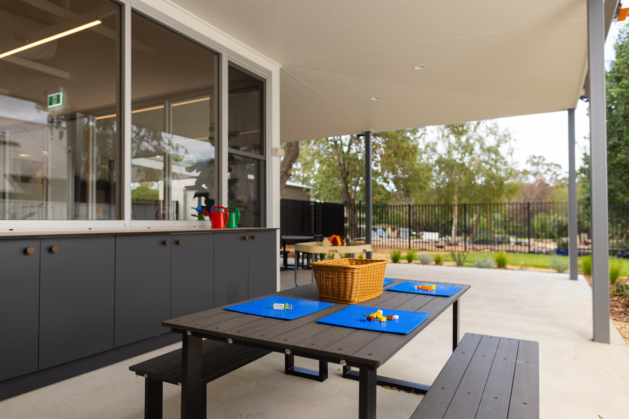 St Michael’s Early Learning Centre outdoor learning and activity area with a children’s picnic table and educational resources
