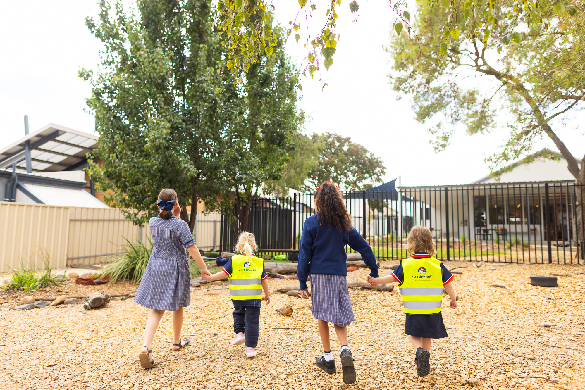 Children exploring an outdoor play area at St Michael’s Early Learning Centre